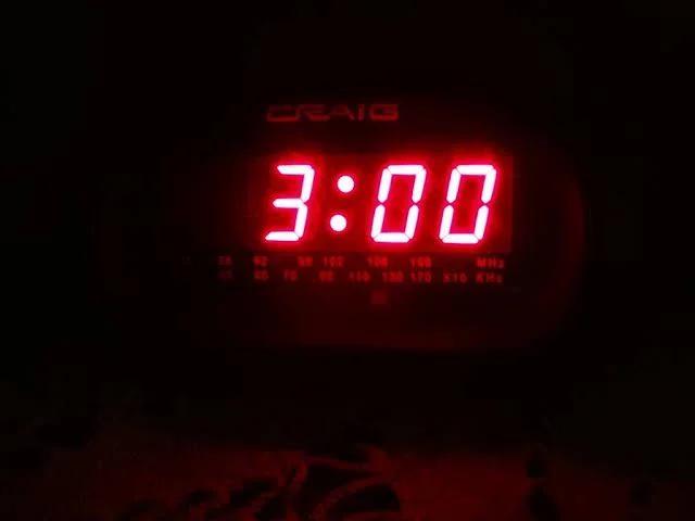 Digital clock reading 3:00 AM, associated with the so-called devil's hour.