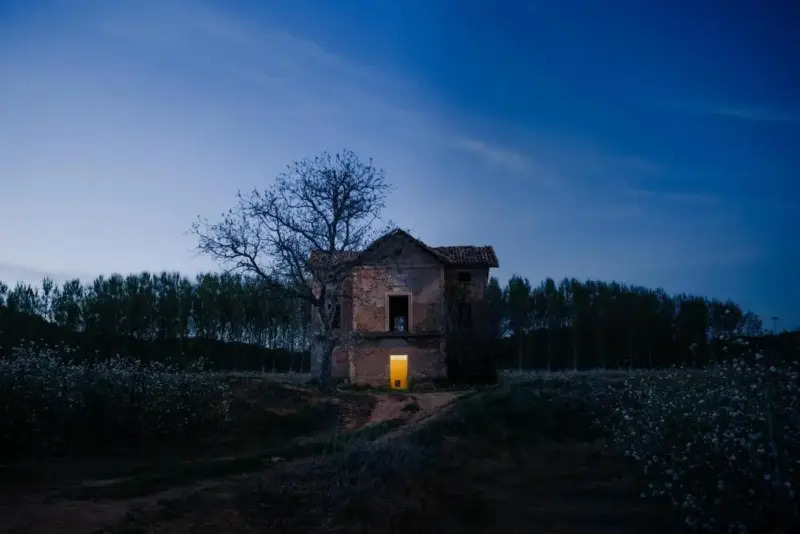 A ghostly haunted house in a field