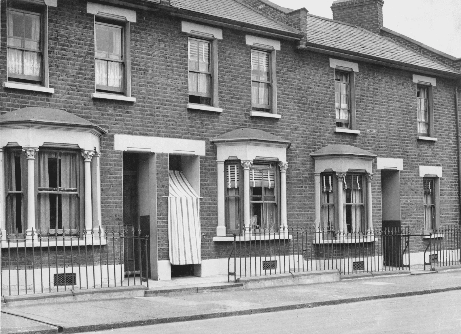Old Victorian terraced houses representing historic properties where signs your house is haunted are often reported.